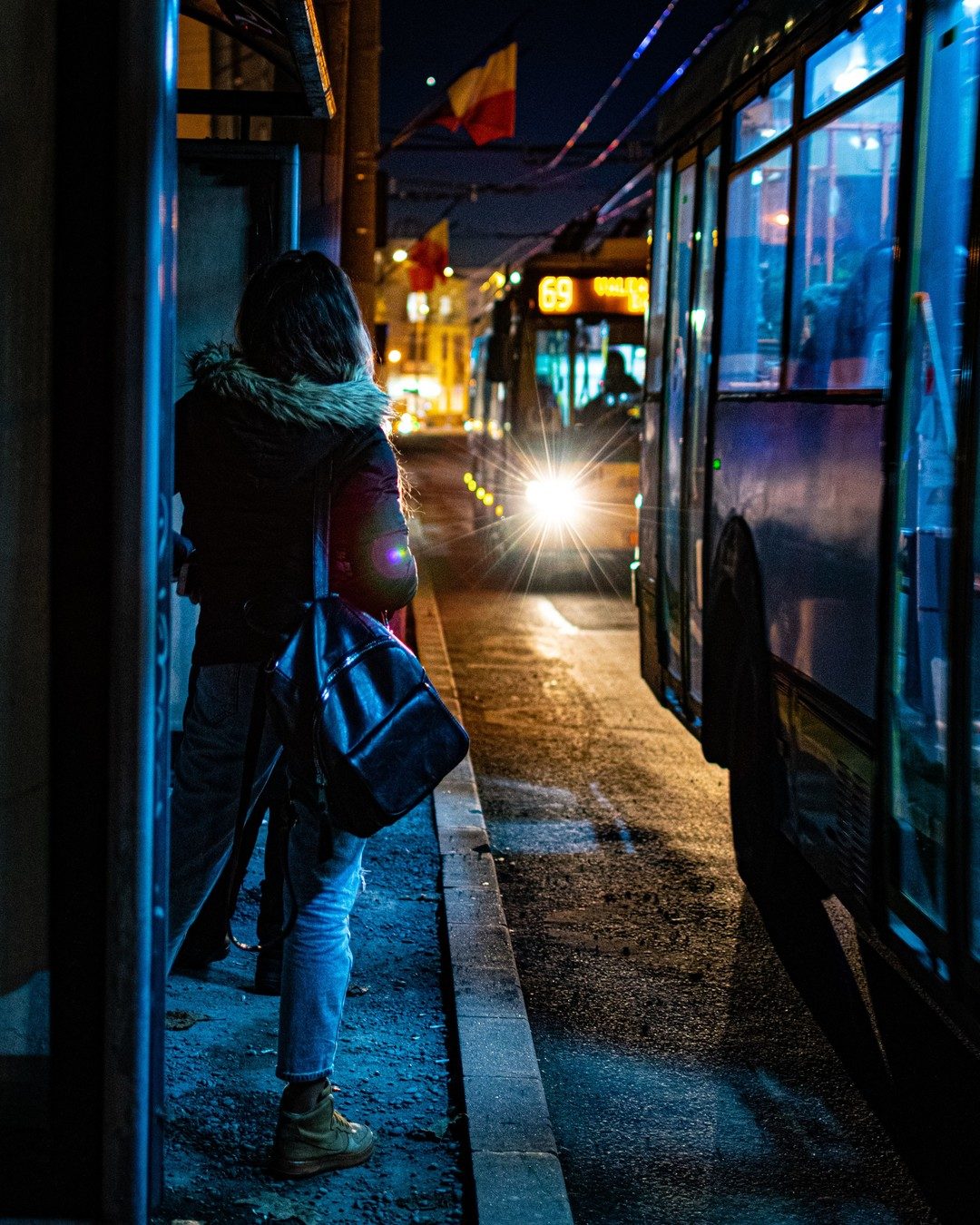 girl-waiting-for-thw-bus-in-the-night-2023-11-27-05-20-02-utc